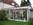 Multiraum als Ecklösung Haus/ Anbau mit nach vorn abgeschrägtem Pultdach, Schiebeverglasung in Vorderfront weiß, Seite Festverglasung